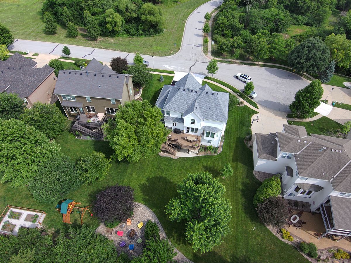 Aerial view of maintained lawns in a residential neighbourhood