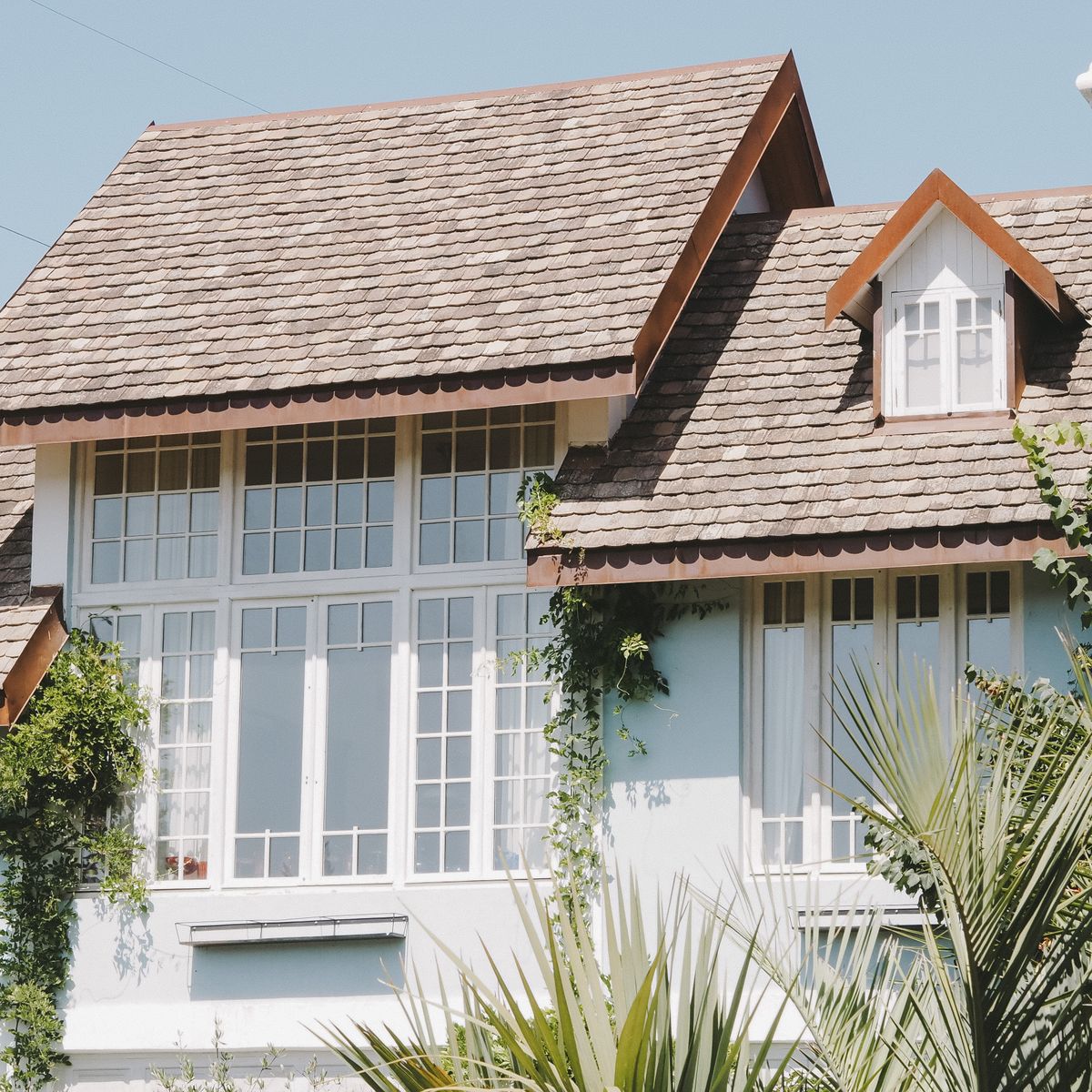 A suburban house with a finished shingled roof